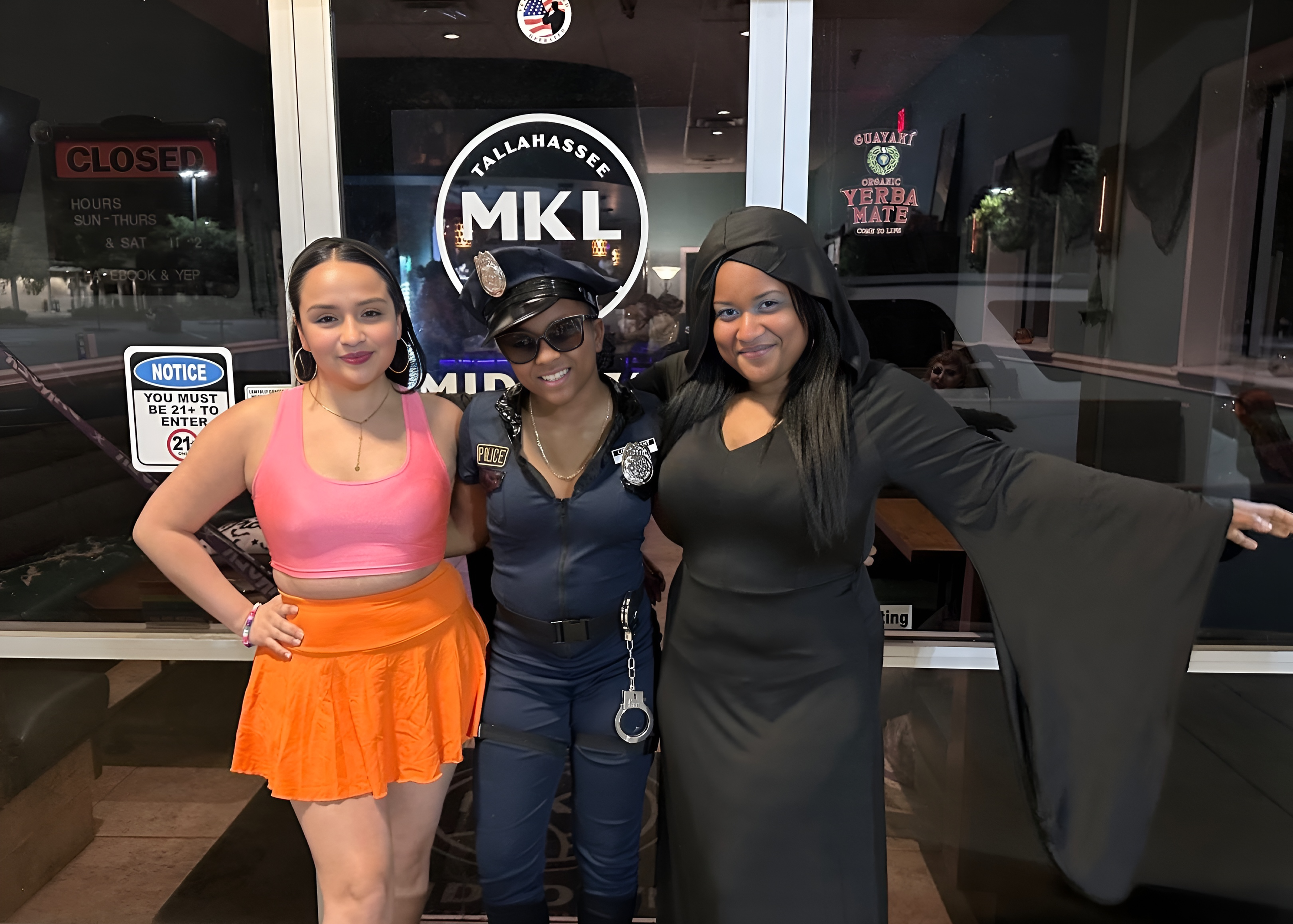 Tiffany, Tiny, and Amanda hanging out on Halloween infront of Midtown Kava Lounge